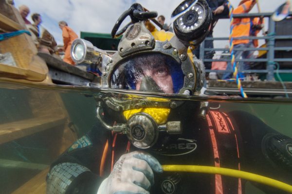 Underwater stills photographer capturing a commercial diver