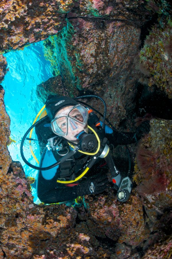 Underwater stills photographer capturing a female diver