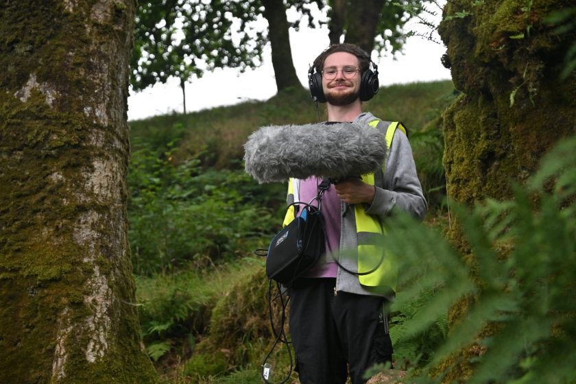 Unit stills photographer taking BTS images of sound crew